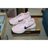 A pair of Nike ladies running shoes UK5