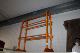 A beech effect towel rail
