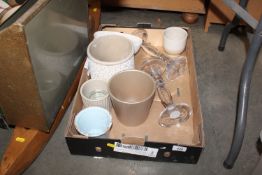 A box containing two glass vases and various plant