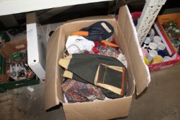 A box containing various fabric, bags, etc.