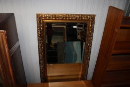 A gilt framed and bevel edged wall mirror