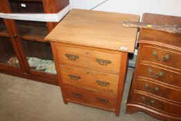 A pine chest fitted three drawers