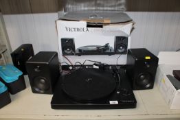 A Victrola stereo turn table together with a pair