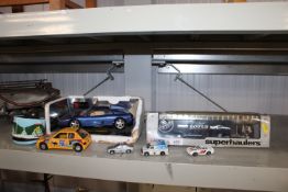 A quantity of various model cars to include a boxed Corgi Super Haulers, Burago etc.