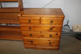 A modern pine chest fitted two short over three lo