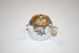 A Japanese Satsuma tea pot, 6.5cm high having char