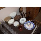 A collection of various pottery jelly moulds including