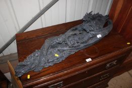 A sword holder in the form of a dragon