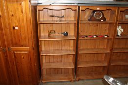 A pine open fronted bookcase with adjustable shelv