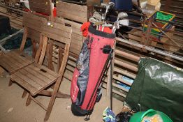 A Progen golf bag and contents of various clubs