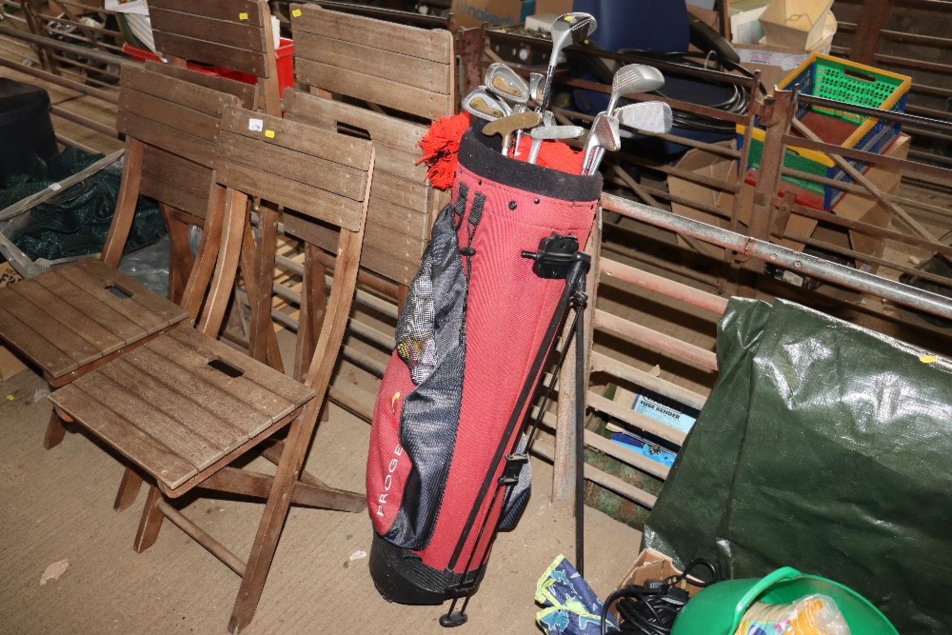 A Progen golf bag and contents of various clubs