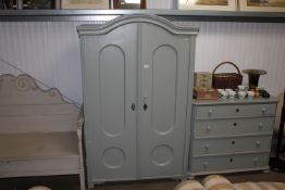 A painted pine two door wardrobe