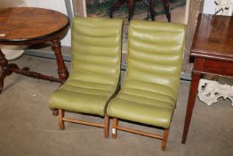 A pair of mid century style accent chairs having g