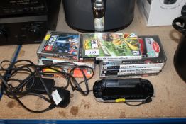 A PSP together with a quantity of various games So