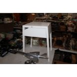 A modern bedside table fitted single drawer