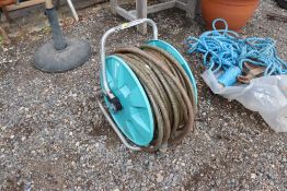 A Gardena garden hose and reel