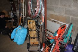 A collection of black metal curtain poles and fitt