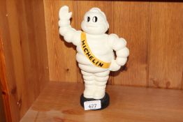 A reproduction Michelin Man money bank (177)
