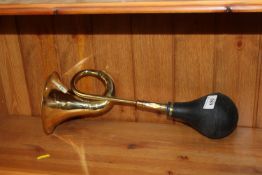 A brass horn (54)