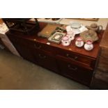 A modern sideboard fitted three drawers