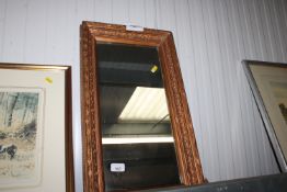 A gilt framed wall mirror