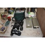 Two Pentax cameras; a Canon, EOS500; various slides and accessories