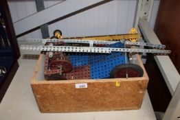 A box containing various Meccano