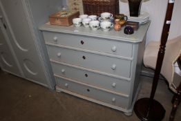 A painted pine chest fitted four long drawers