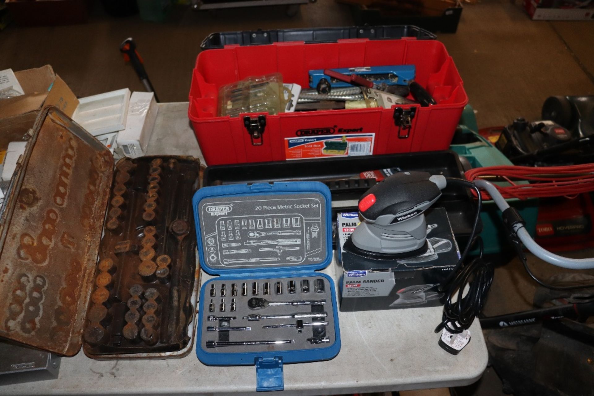 A Wickes electric palm sander, a draper tool box a