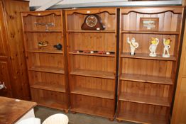 A pine open fronted bookcase with adjustable shelv
