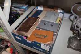 A box containing various books; cash tins; a King