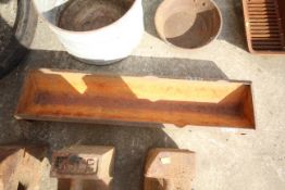 Cast iron trough.