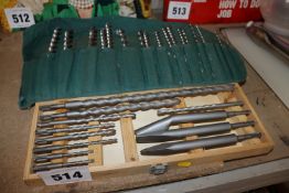 Box of SDS drill bits and a pouch of wood auger bi