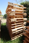 Stack of large shipping pallets.