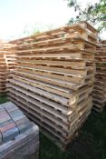Stack of large shipping pallets.