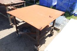 Square welding bench on wheels.