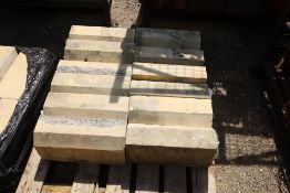 Pallet of stone replica window surrounds.