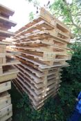 Stack of large shipping pallets.
