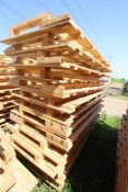 Stack of large shipping pallets.