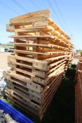 Stack of large shipping pallets.
