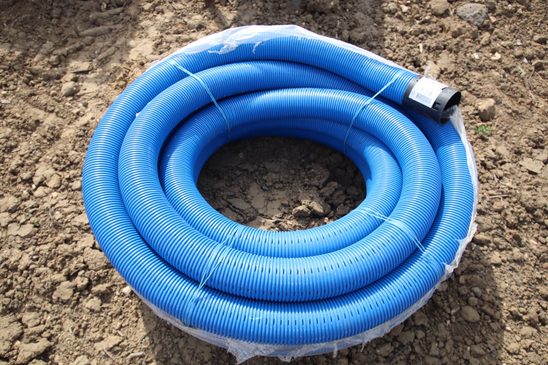 Roll of drainage pipe.