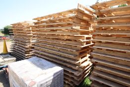 Stack of large shipping pallets.