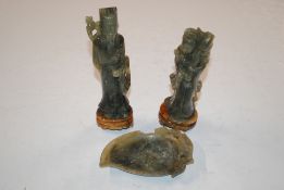 A pair of Oriental carved stone figures AF, 18cm high; and a carved stone dish AF