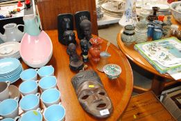 Various carved hardwood Ethnic figures; a Canton type bowl and cover; a copper side pouring