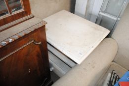A white bedside cabinet