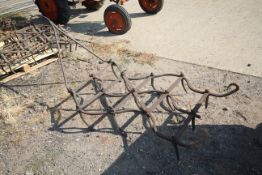 Single large heavy harrow.
