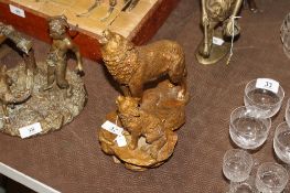 A bronzed figure group of wolf and howling cub