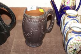 A Victorian Doulton Lambeth silicon ware leather jack jug with silver rim