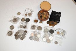 A box of various coinage to include Royal Commemorative Crowns, Churchill crowns, 50pence pieces