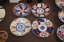 Four Imari patterned plates